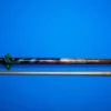 Close-up of the points and inlay craftsmanship on the forearm of the Phoenix cue.