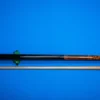 Full view of the handcrafted Lord of the Rings pool cue made with amboyna burl and ebony