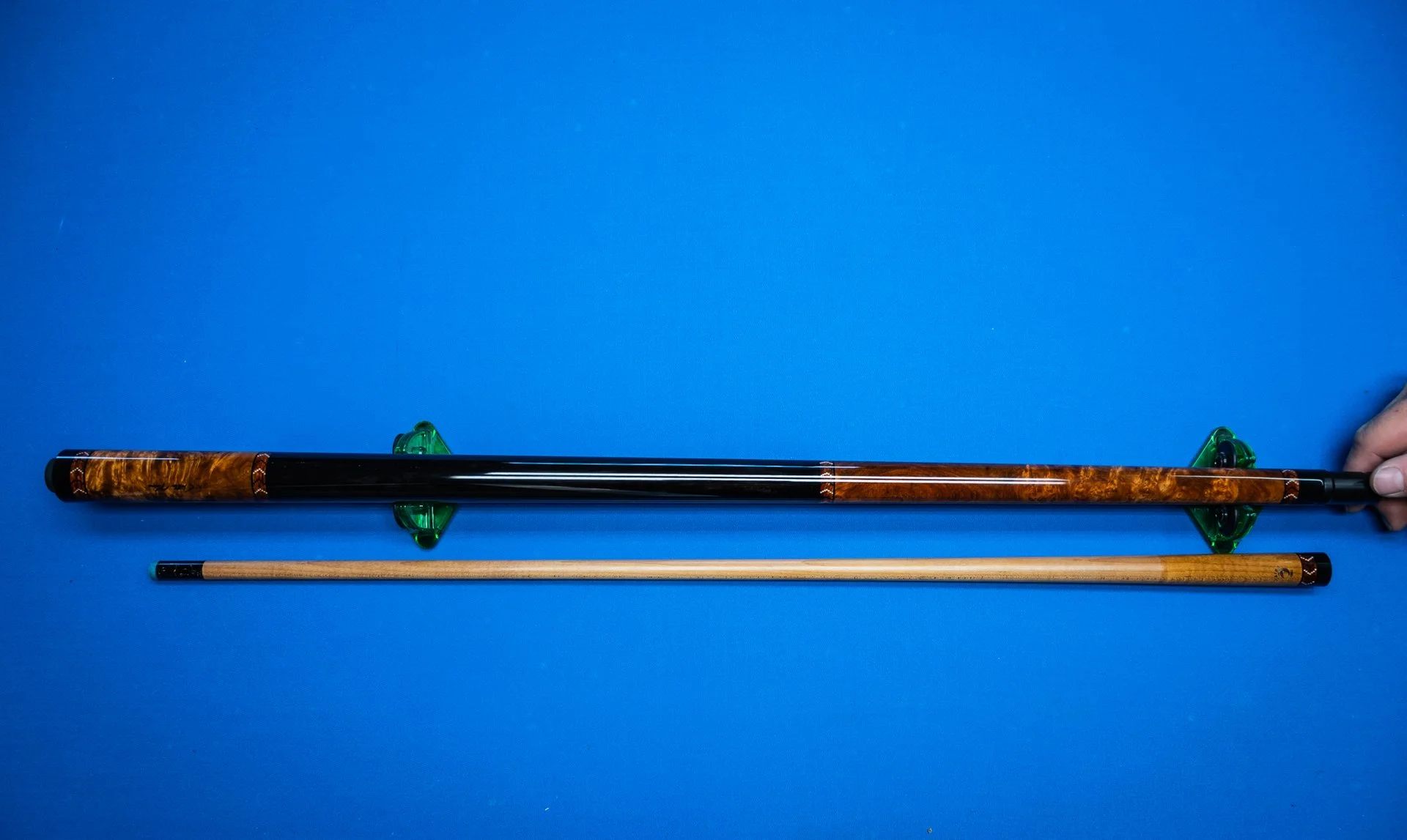Full view of the handcrafted Lord of the Rings pool cue made with amboyna burl and ebony