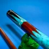 Close-up of the 237 turquoise, mother of pearl, and sterling silver inlays on the custom cue