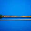 Full view of the handcrafted Coral pool cue featuring blue resin stabilized amboyna burl