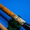 Close-up of the sterling silver rings and inlay dots on the Coral custom cue